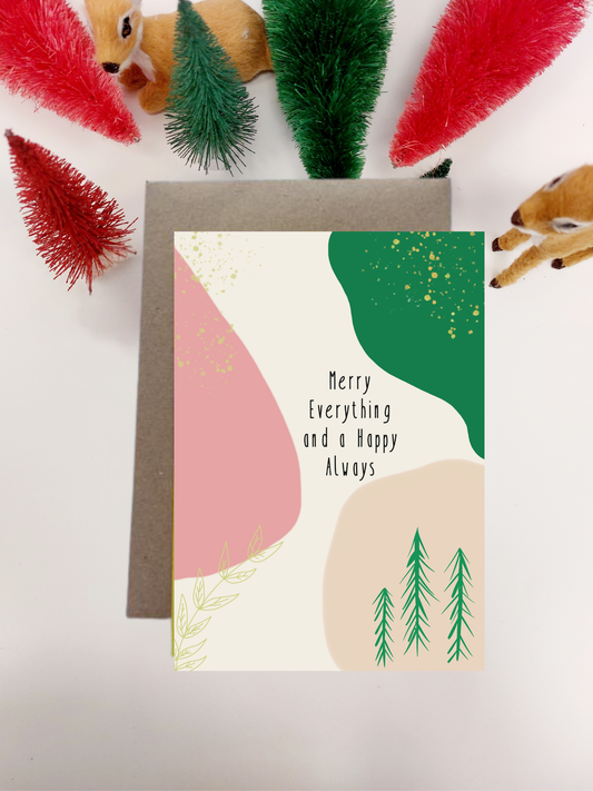 Irish Made Christmas Card with abstract design and text, surrounded by festive decorations on a light background